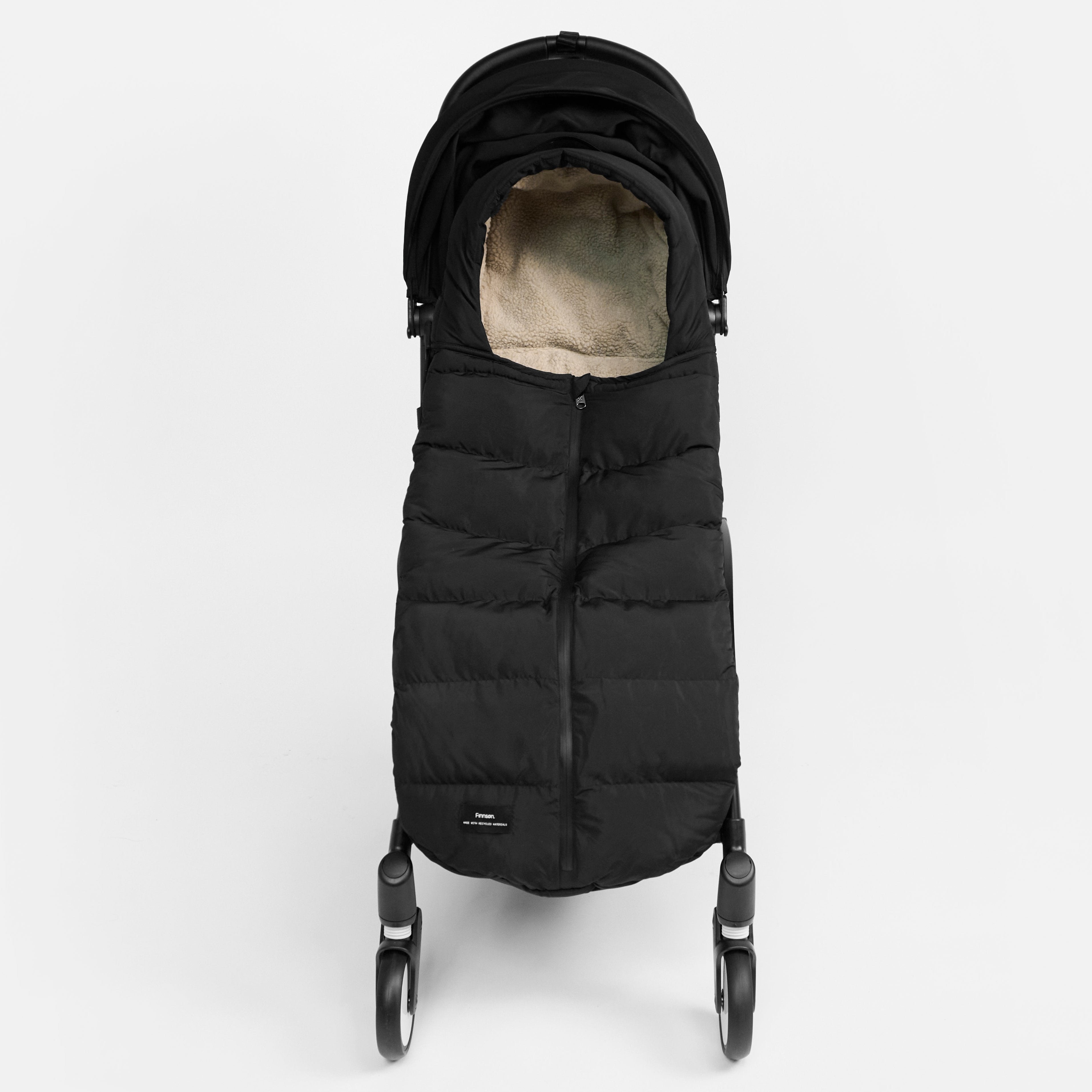 FINNSON ALMA BLACK FOOTMUFF FRONT SHOT ON PRAM