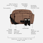 Freya check checkered crossbody bag with black straps and text callouts detailing its features, dimensions, and materials on a light gray background.