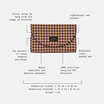 Oslo travel change mat on a light gray background with surrounding callout text and dotted lines explaining features such as a velcro strap, two pockets, removable inner pad, water repellent and machine washable fabric, and recycled PET material.