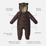 Anders choco leopard print snow suit, featuring a plush cream fleece lining and bear ears on the hood. The image includes text callouts with dotted lines pointing to features like 'Lightweight and durable', 'Machine washable', 'Wind and water resistant', 'Breathable', 'Padded and quilted for extra comfort', and '0-12 months with feet, 12 months+ without feet'.