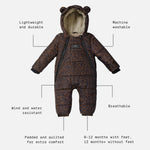 Anders choco leopard print snow suit, featuring a plush cream fleece lining and bear ears on the hood. The image includes text callouts with dotted lines pointing to features like 'Lightweight and durable', 'Machine washable', 'Wind and water resistant', 'Breathable', 'Padded and quilted for extra comfort', and '0-12 months with feet, 12 months+ without feet'.
