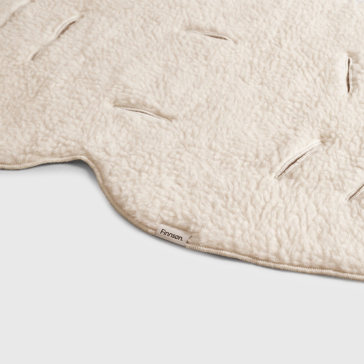 Close-up of astor merino wool lining and 'Finnson' branding.