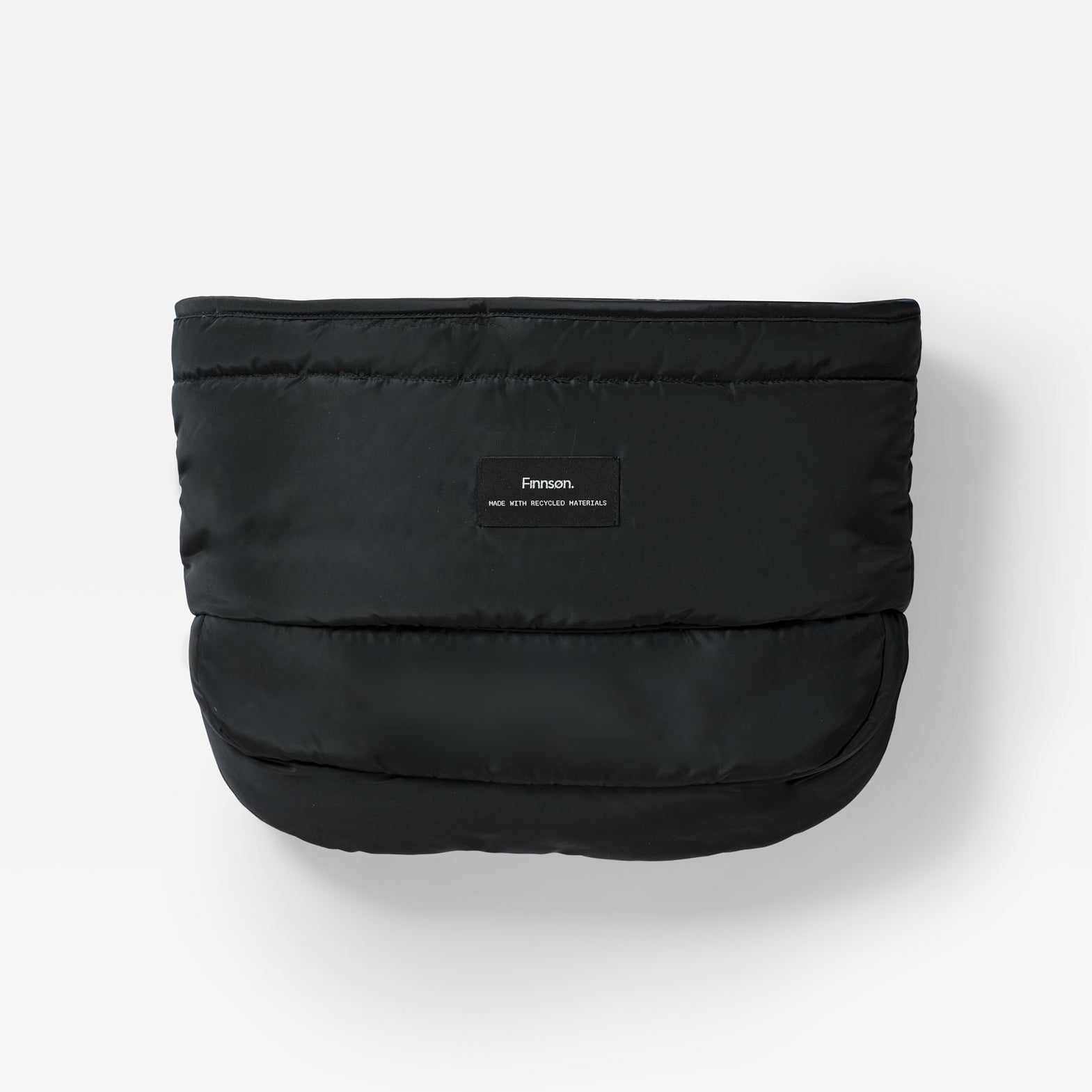 Agnar black puffer-style stroller mitten with a small rectangular brand label on the front, photographed against a clean white background.