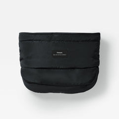 Agnar black puffer-style stroller mitten with a small rectangular brand label on the front, photographed against a clean white background.