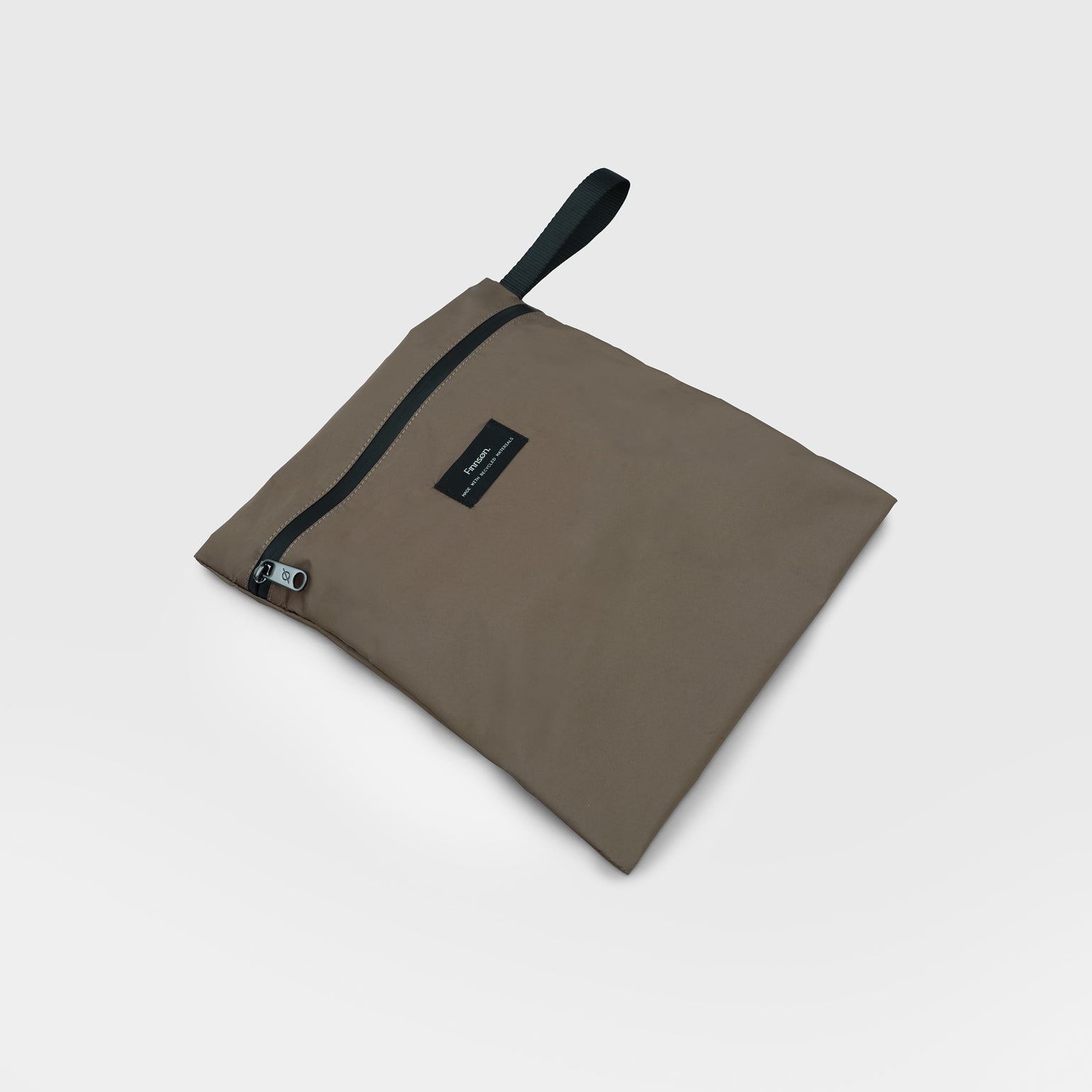 Elias mocha wet bag on a light gray background