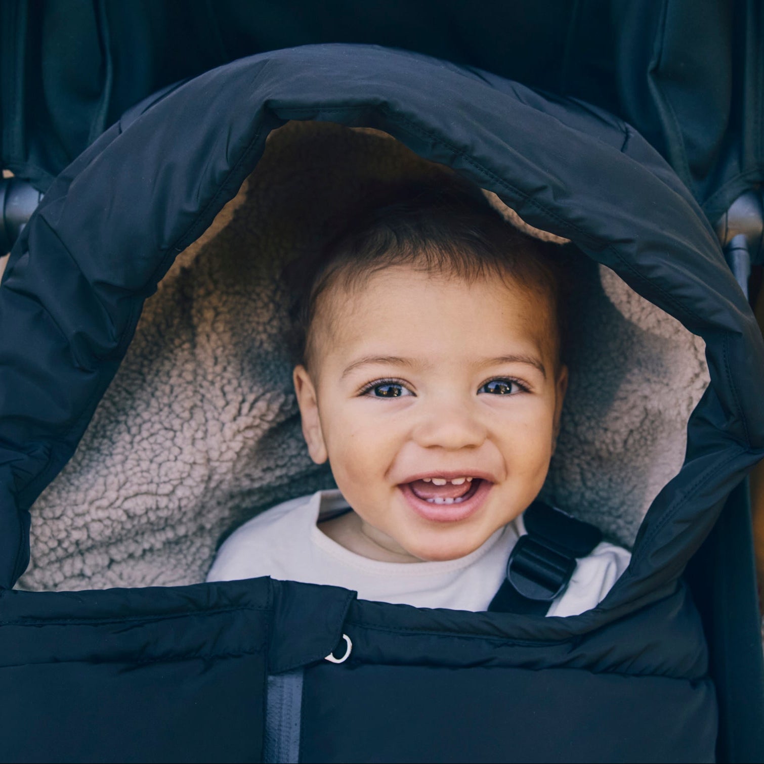 Alma black footmuff with baby
