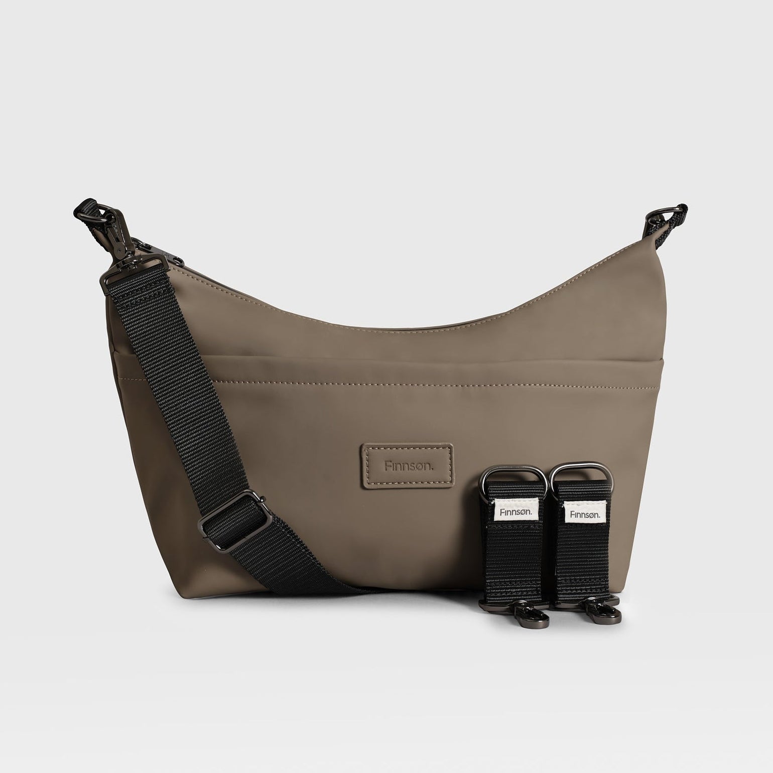 Fia mocha stroller organiser with black straps and matching tags on a light gray background