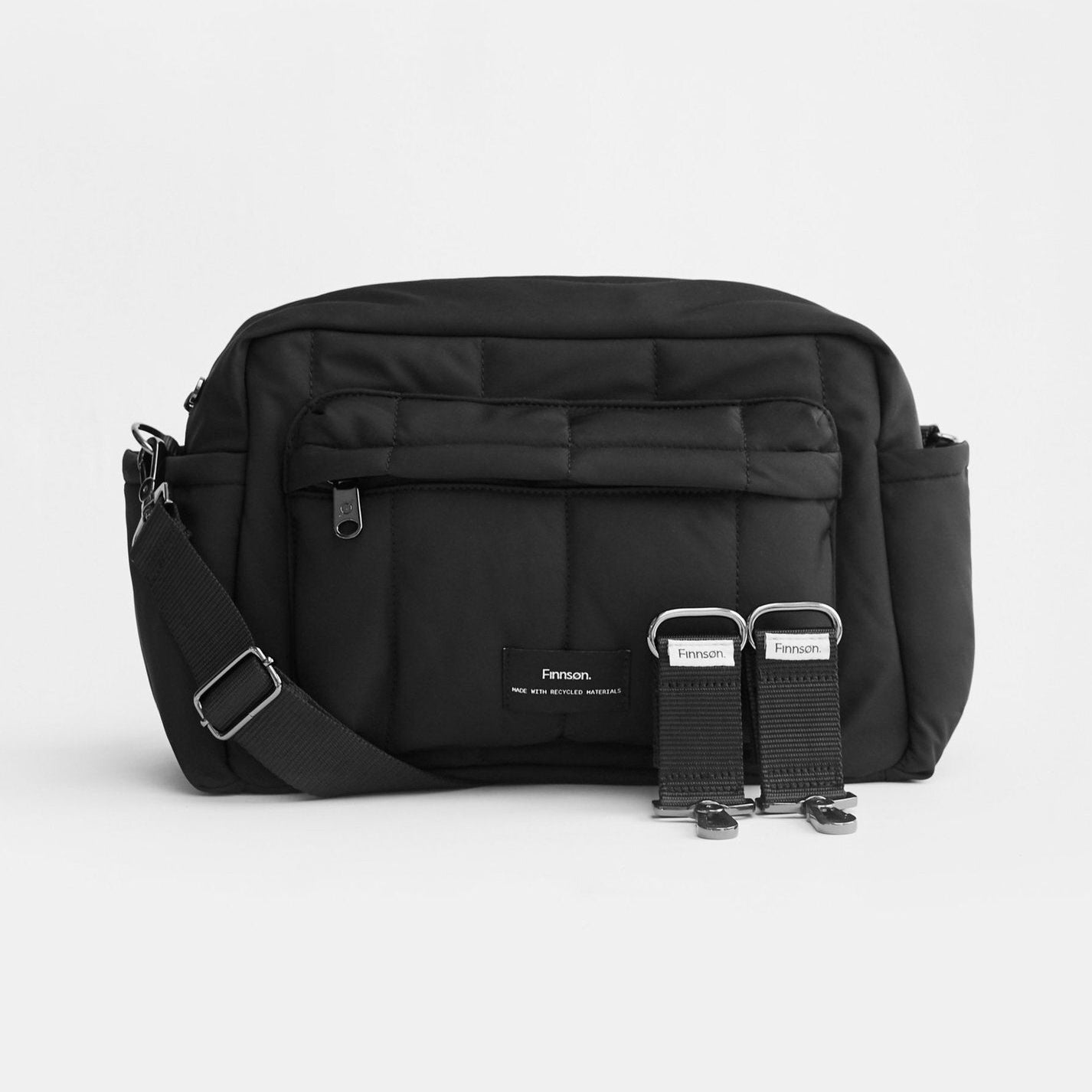 Freya eco stroller organiser black bag and a stroller clip. It includes a detachable crossbody strap.
