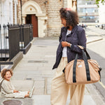 FINNSON IDA HOLDALL CAMEL MOTHER BAG WHILST CHILD LAUGHS