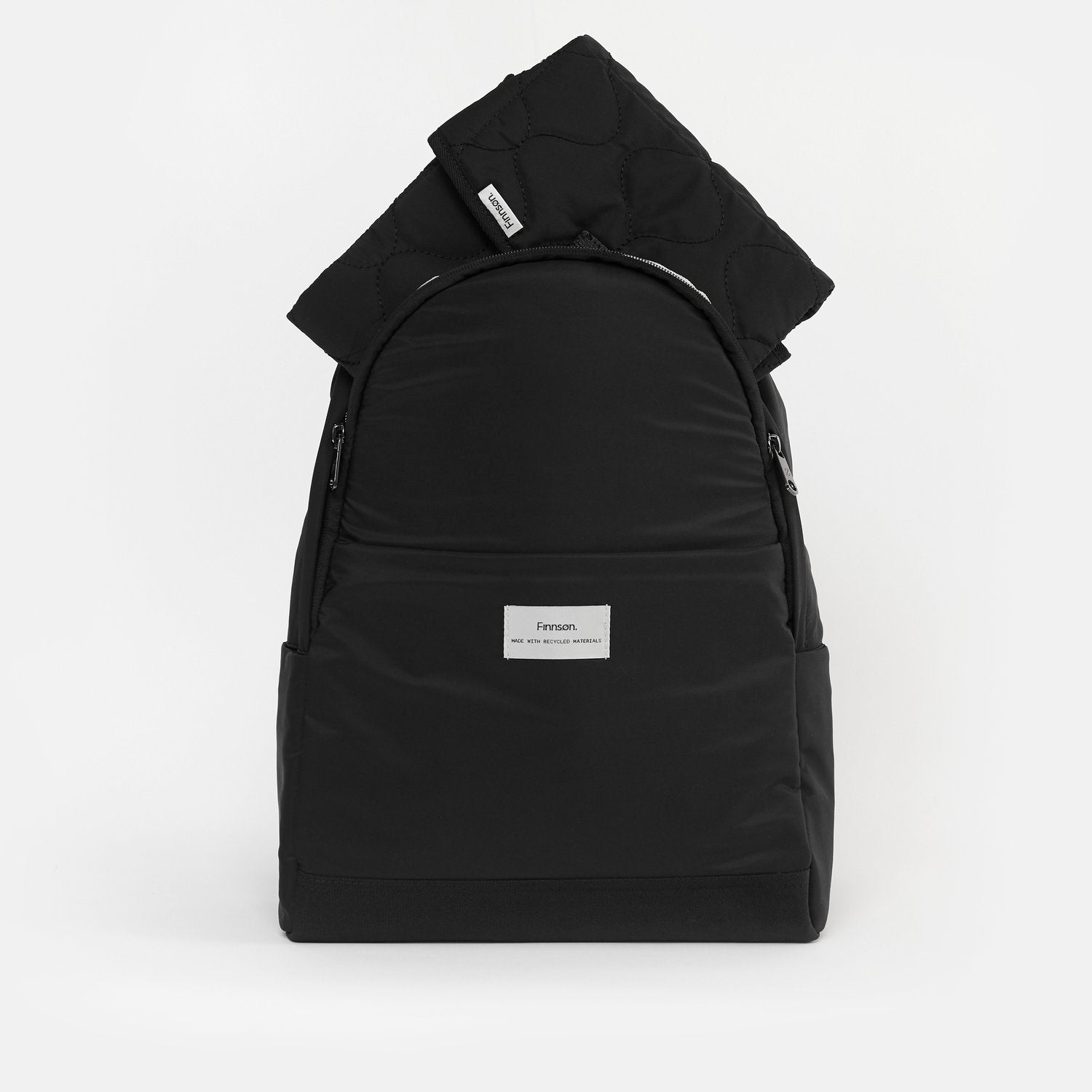 FINNSON INGE BACKPACK BLACK FRONT SHOT WITH CHANGING MAT INSIDE BAG