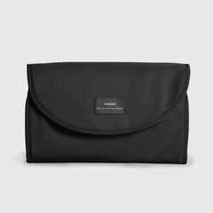 Oslo black changing mat with a brand label on a light gray background