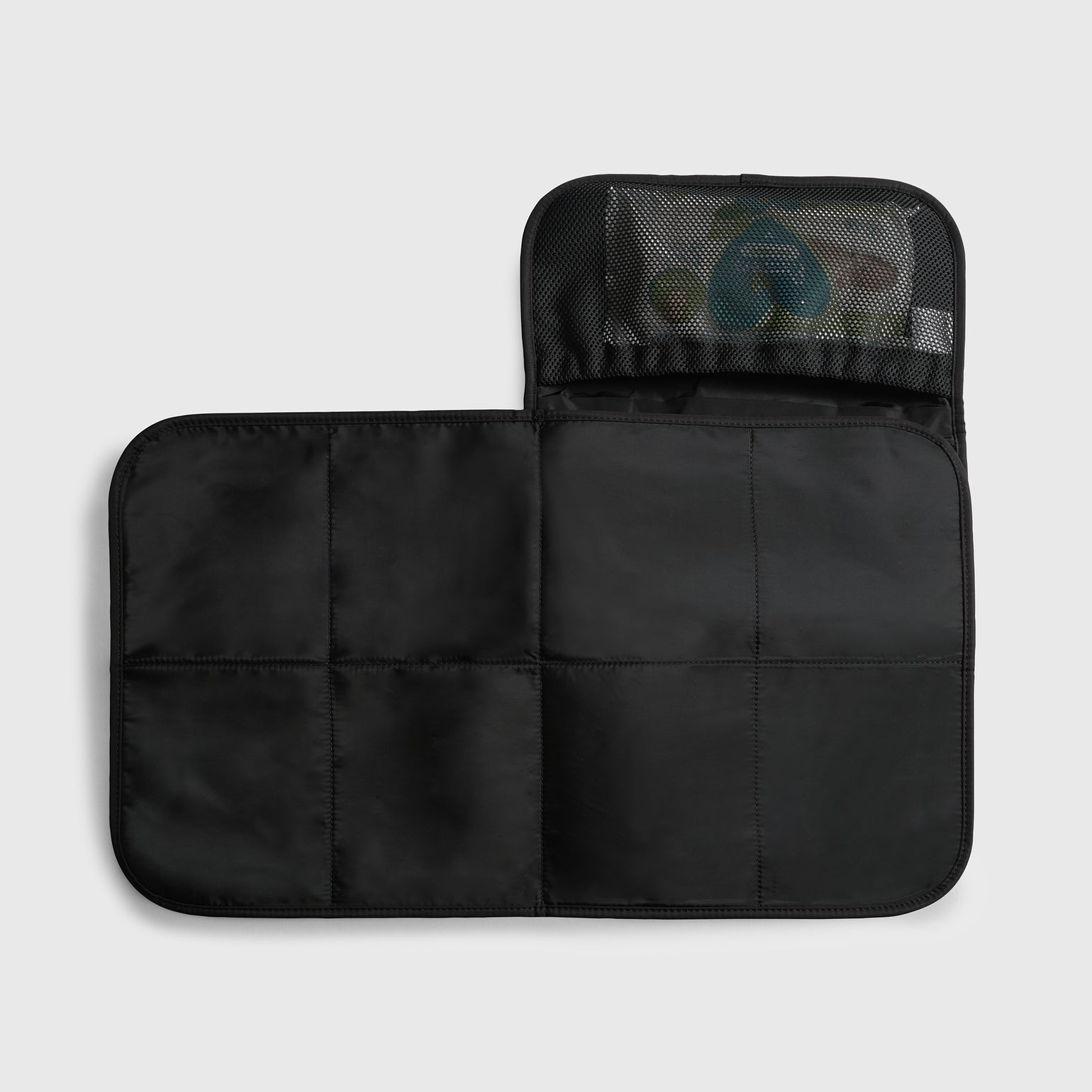 Oslo black travel changing mat, shown open to reveal the unfolded size of the mat and Internal mesh pocket for nappies, wipes and/or creams.