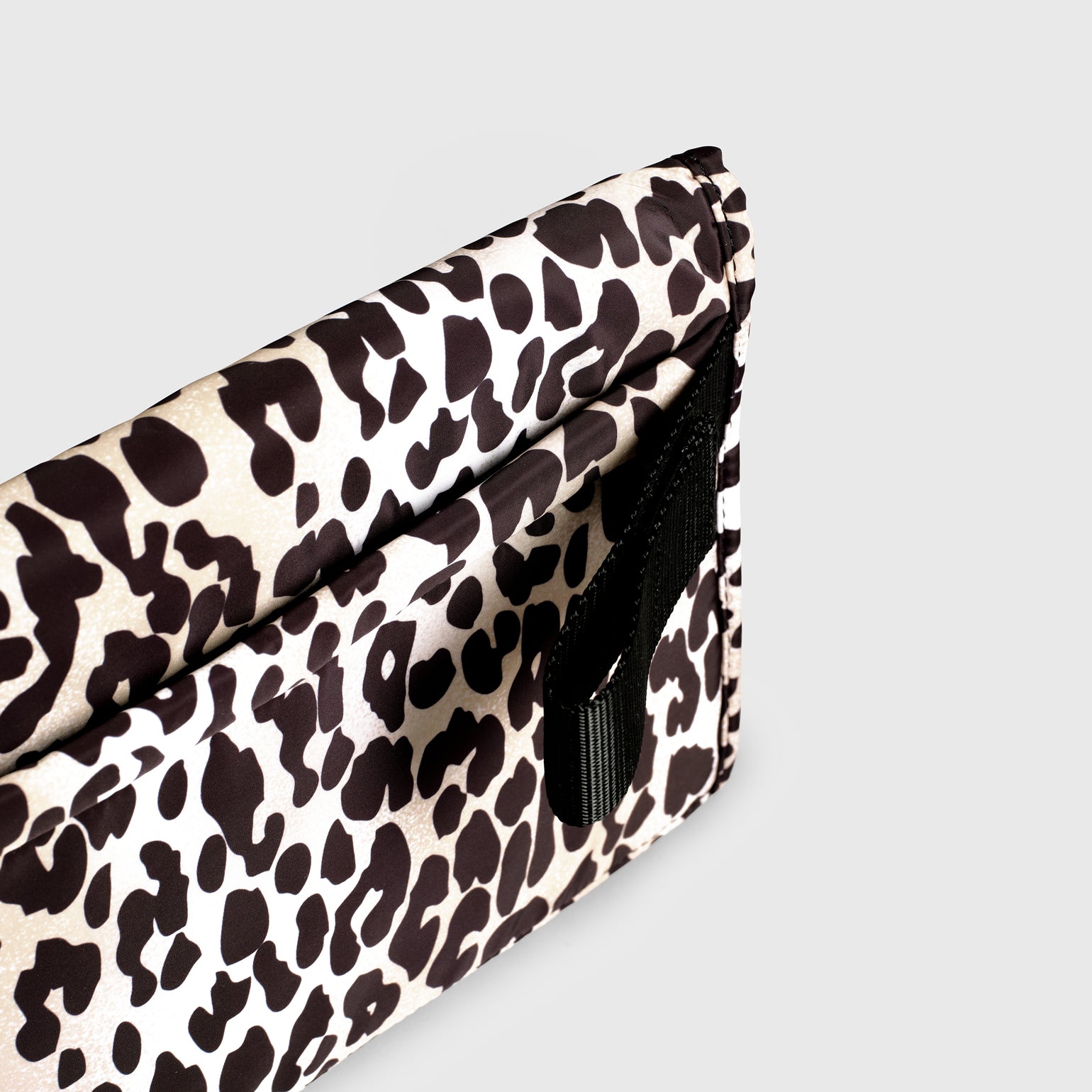 Close up look of oslo leopard print changing mat  on a light gray background