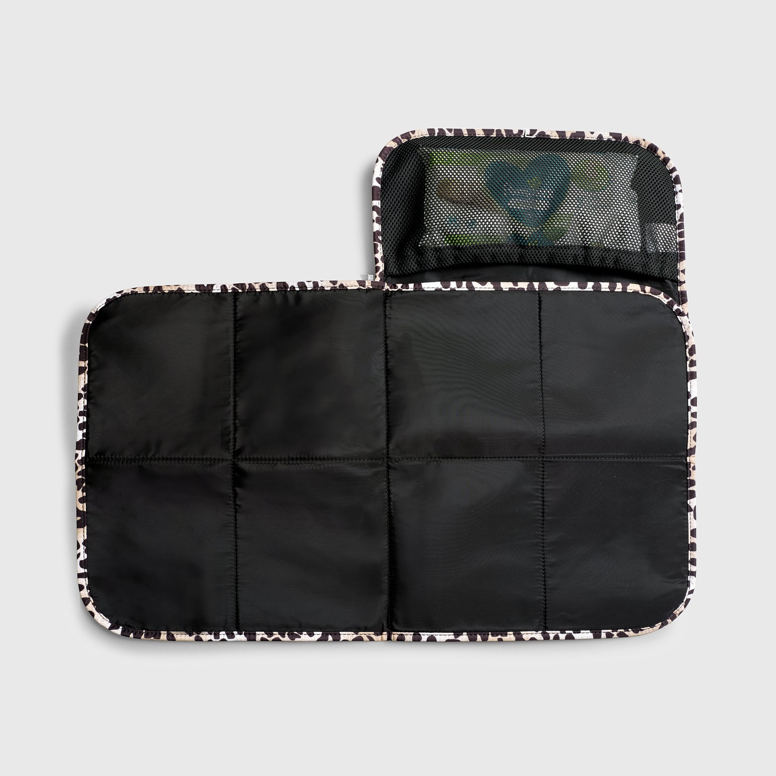 Oslo leopard print travel changing mat, shown open to reveal the unfolded size of the mat and Internal mesh pocket for nappies, wipes and/or creams.