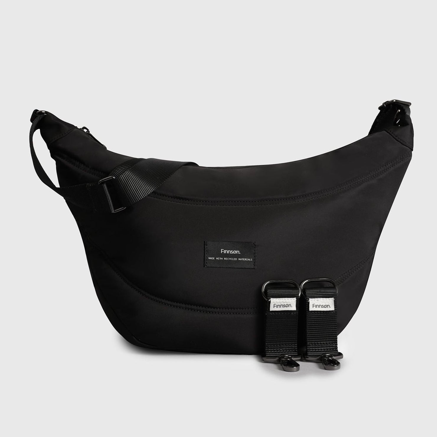 Osma stroller organiser black bag with stroller clips on a light gray background