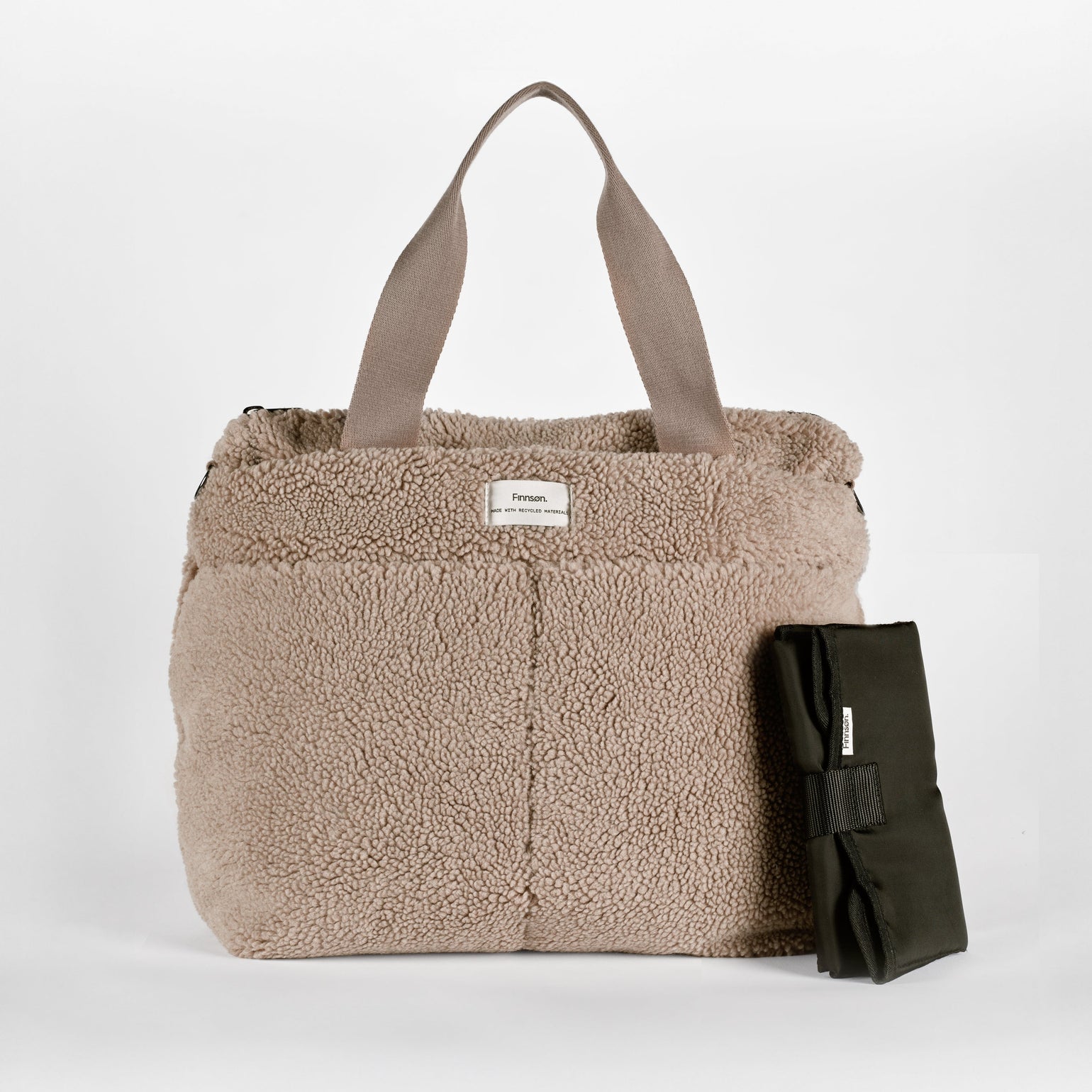 Sigrid mocha borg changing bag with a matching padded black travel changing mat, showcasing a coordinated baby changing set designed for convenient diaper changes on the go
