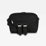 The Fern black stroller organiser with an adjustable shoulder strap and two front webbing loops featuring the 'Ferman' brand name, shown against a light gray background.