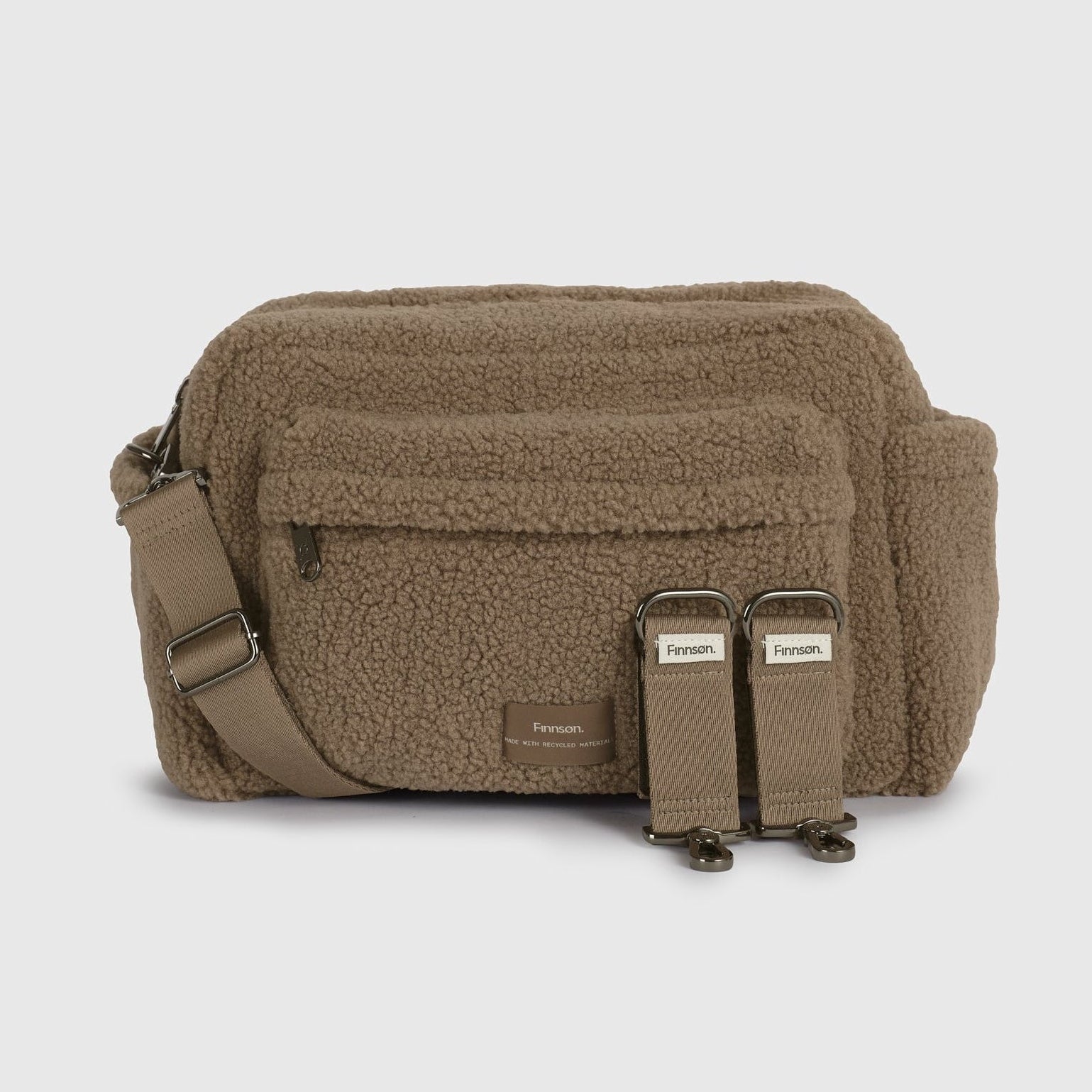A freya mocha borg bag with an adjustable shoulder strap and two stroller clips, shown against a light gray background.