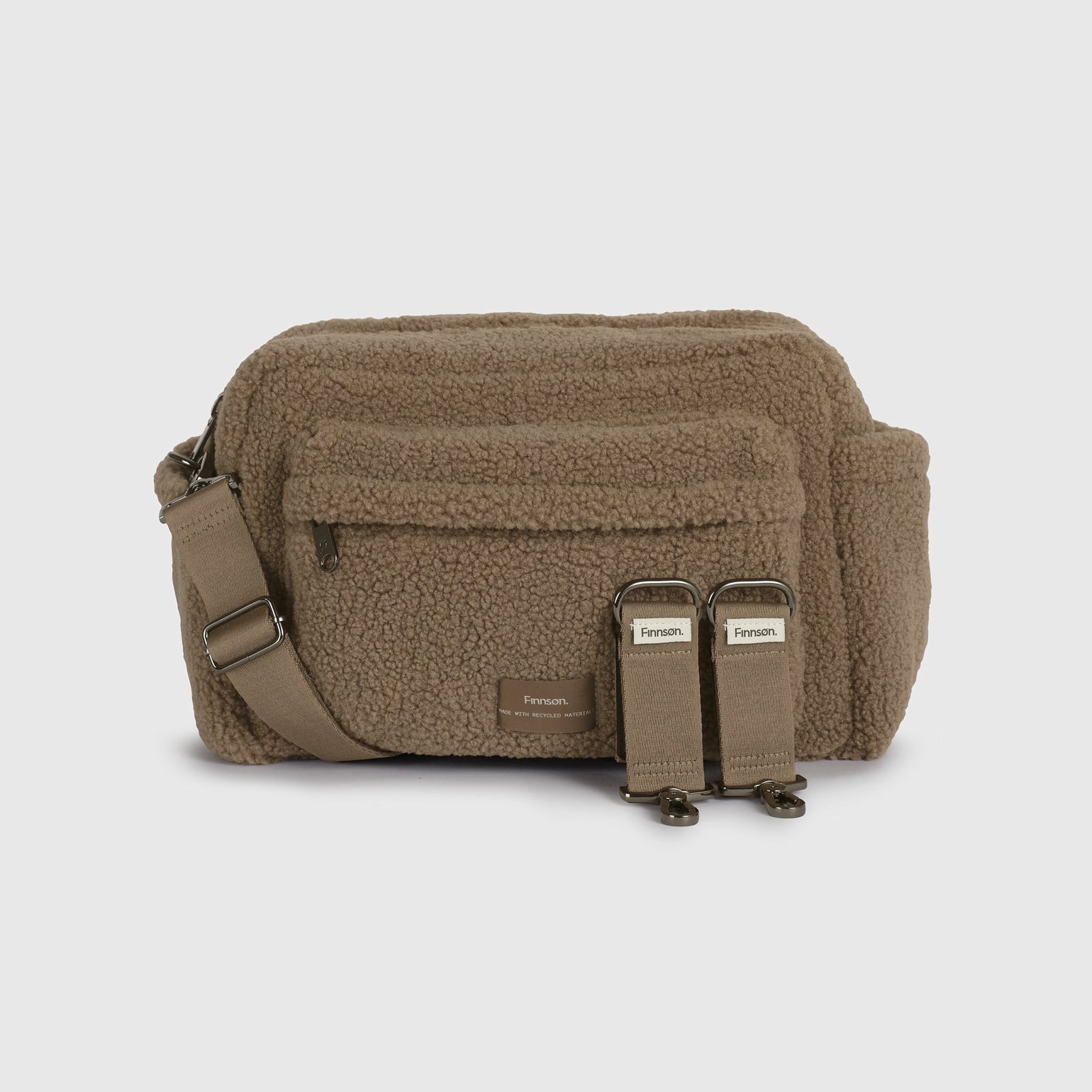 A freya mocha borg bag with an adjustable shoulder strap and two stroller clips, shown against a light gray background.