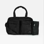 The Finnson Iris diaper bag with dual top handles, a detachable shoulder strap, and a side pouch, shown against a plain light gray background.