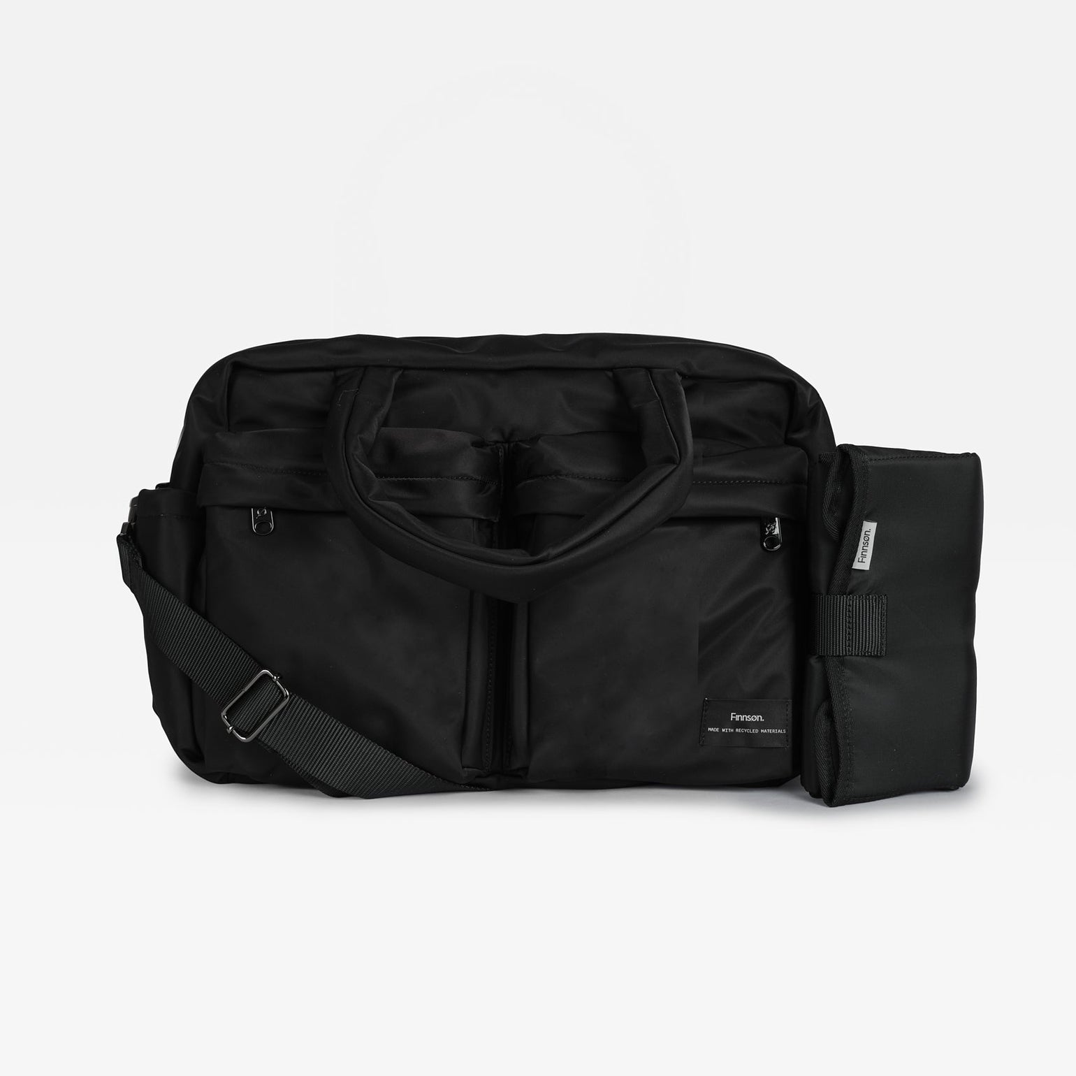 The Finnson Iris changing bag with a detachable shoulder strap and a black changing mat on the side, photographed against a plain light gray background.