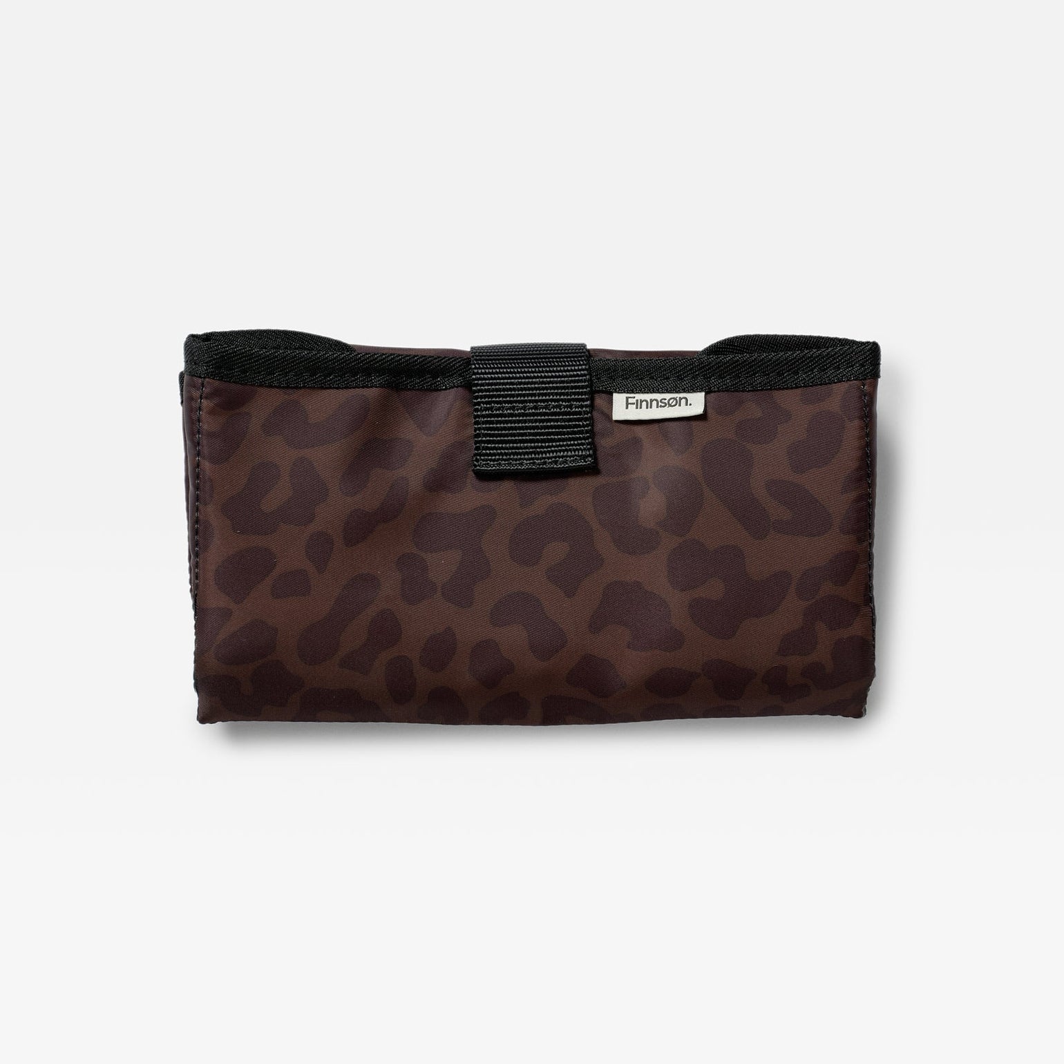 Noa chocolate animal leopard print changing mat with a black strap closure and a small silver brand tag Finnson, photographed on a clean white background.
