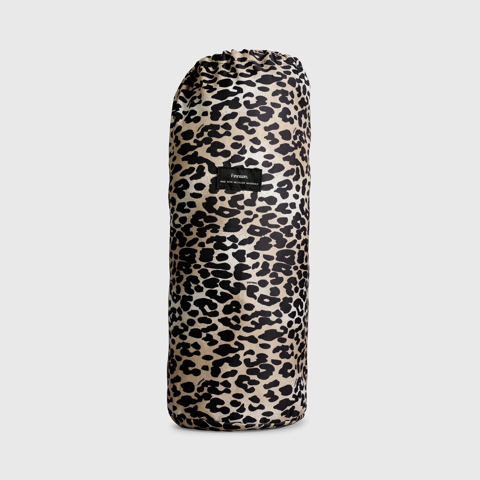 thoren outdoor/indoor playmat  in leopard print drawstring bag with a visible brand label on a light gray background