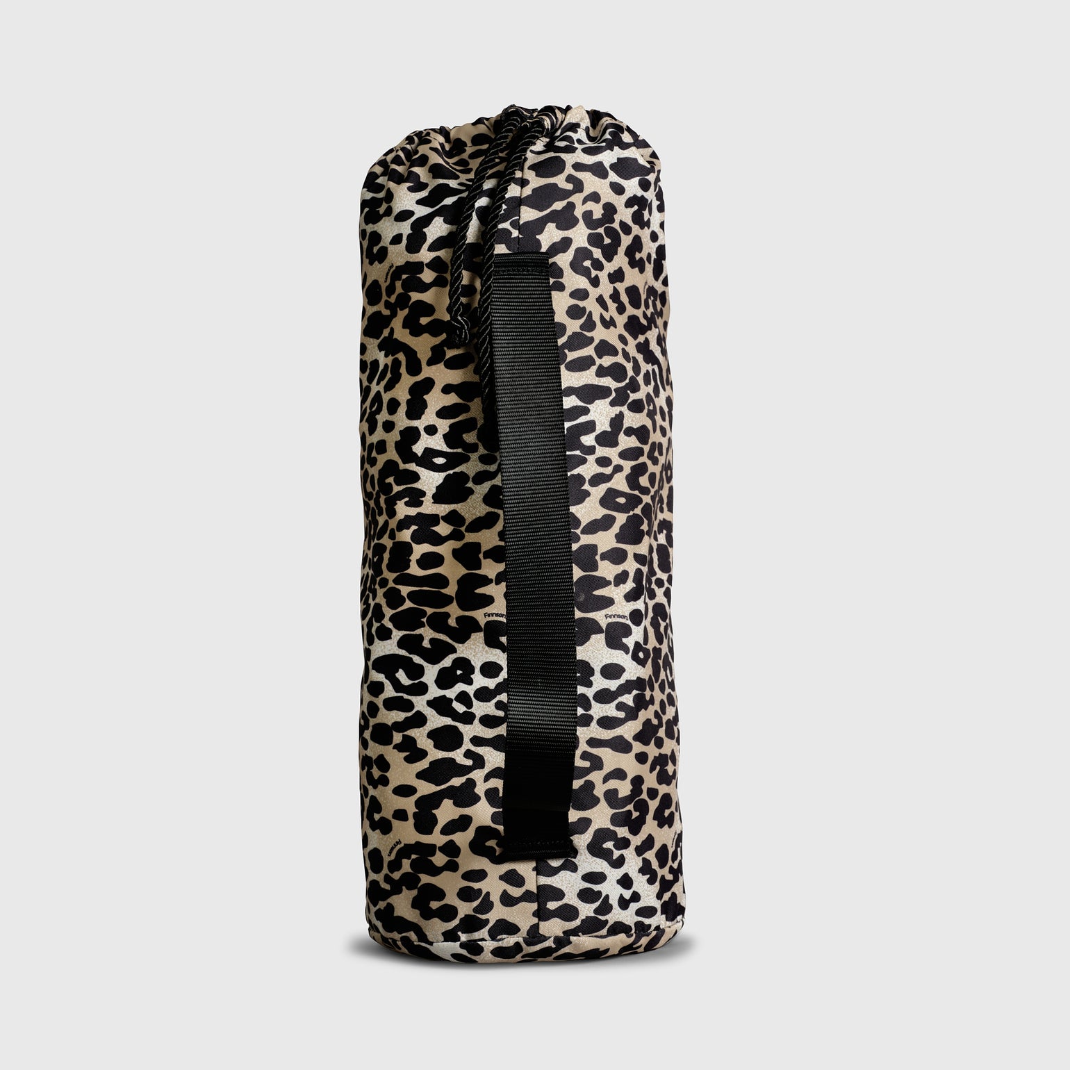 Leopard print drawstring bag on a light gray background