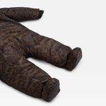 A close-up of the Anders brown and black leopard-print puffer footed one-piece snowsuit, showing the quilted fabric texture and pattern on the legs and feet, set against a plain light gray background.