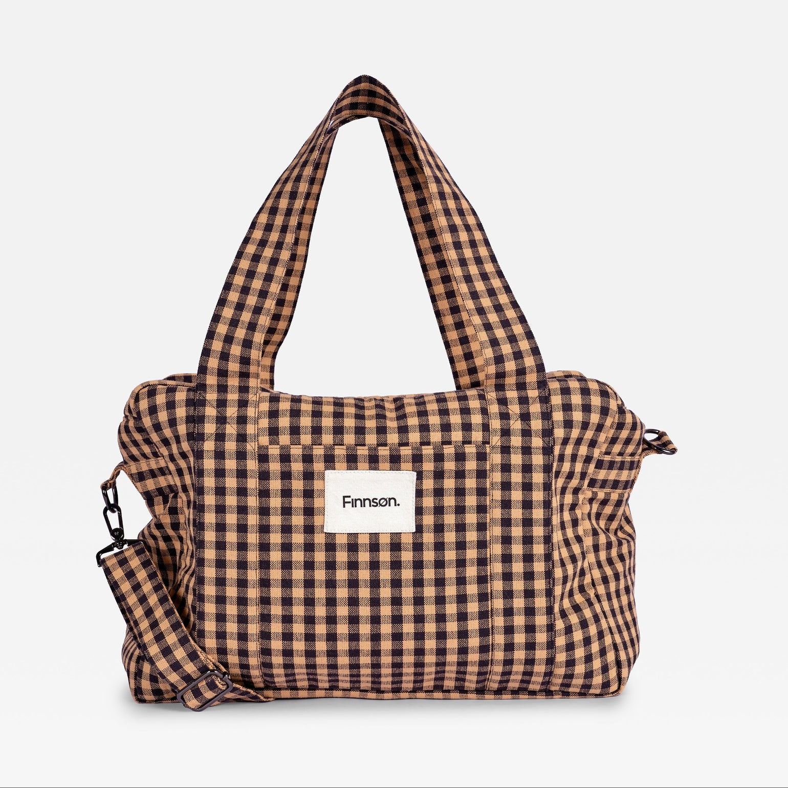 A brown and beige gingham checkered changing bag with dual top handles and a detachable shoulder strap, featuring a white front patch with the brand name 'Finnson'.