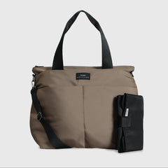 Sigrid Eco Stroller Organiser Bag in Mocha with a matching padded black travel changing mat, showcasing its spacious design, adjustable shoulder strap, and practical baby-changing essentials for everyday outings. 