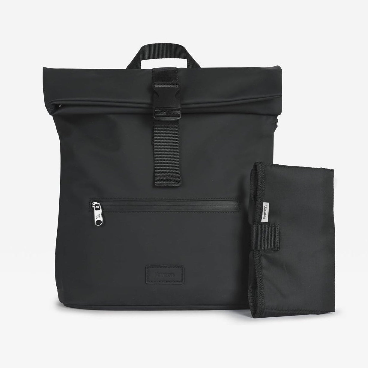 The Finnson Viggo black roll-top backpack shown with its matching black fold-out changing mat beside it, photographed on a clean white background.